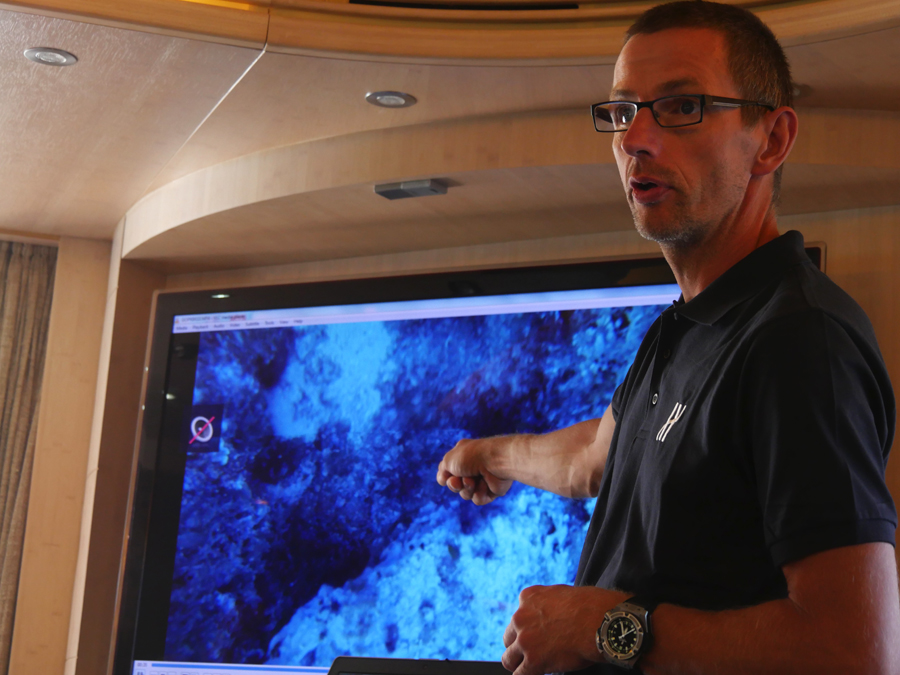 Phil Short providing a post dive team briefing onboard GLAROS*.